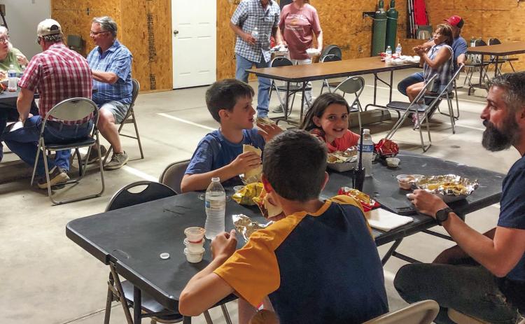 Patrons of the Wellington Emergency Medical Services (EMS) 2023 fundraiser dine. The Wellington EMS staff orchestrated a soft taco fundraiser from 6-8 p.m. Tuesday, June 13 at the Wellington EMS Barn. Staff serve pulled pork or taco meat, along with an array of ingredients, on a flour tortilla, as well as chips and a bottle of water. Wellington EMS Administrator Farris Nation expressed his appreciation for all in attendance and is grateful for the $2,000 collected in donations. The Red River Sun/Bev Odom