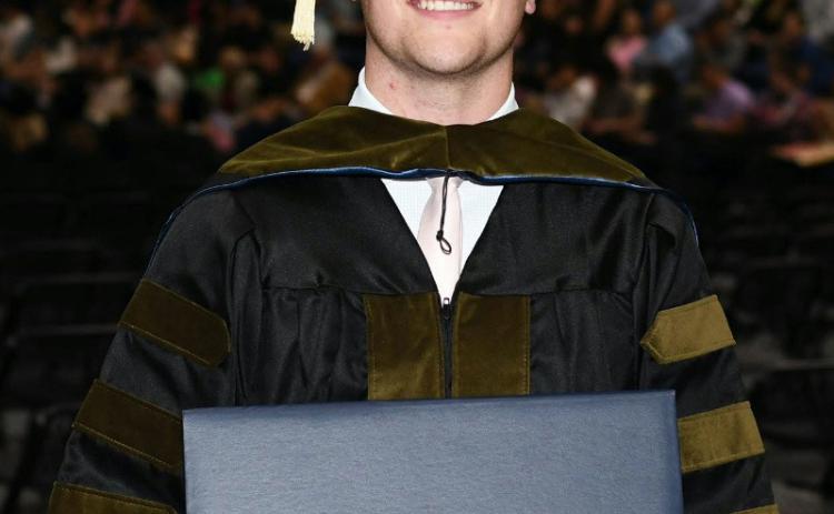 Cory Bodine, of Quanah, accepts his Doctor of Pharmacy Degree from Southwestern Oklahoma State University. Courtesy Photo
