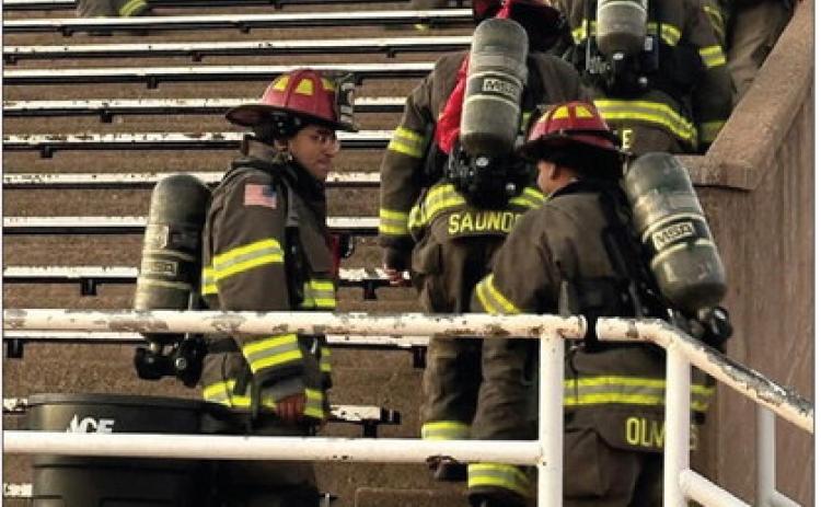 Childress firefighters climb the steps at Charlie Johnston Field on September 11 to mark the 25th anniversary of the terrorist attacks on America and the first responders who died that day. PHOTO BY MARKIA WILLIS