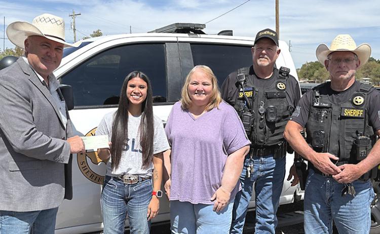 Sidda Thomas of Memphis, daughter of Dave and Deneen Thomas, was awarded a $2,000 scholorship from the Texas Chief Deputies Association. Shown here are Kevin Halbert of the Texas Chief Deputies Association, Sidda Thomas, Deneen Thomas, Dave Thomas, and Hall County Sheriff Tom Heck. COURTESY PHOTO