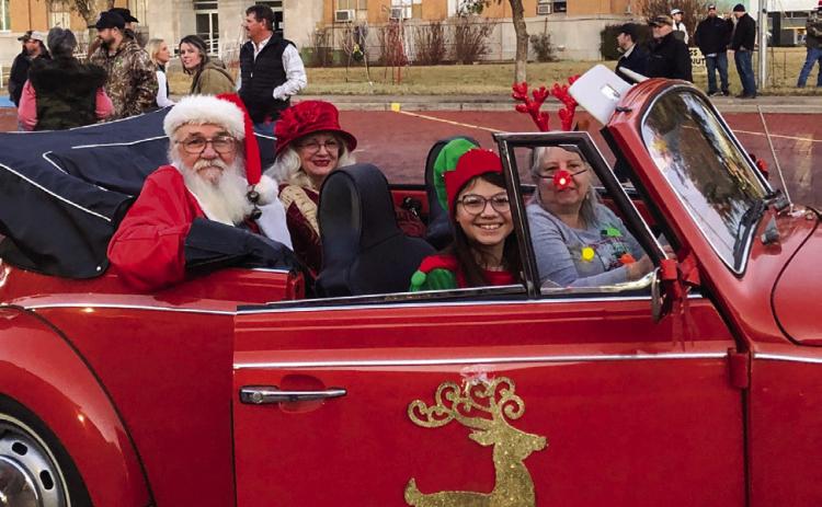 For the December 2023 Lighting of the Collingsworth County Courthouse Square, Helena Stanley chauffeurs Santa and Mrs. Claus, accompanied by their elf, Brianna Torrez. The famous courthouse star lit up around dusk with the festive Christmas light display. The Red River Sun/Bev Odom