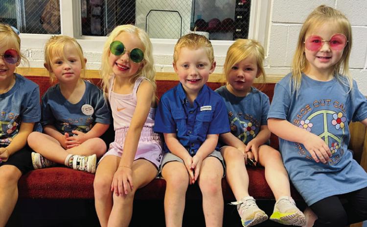 Supporting Hearts United Give Support’s (HUGS) youngest client, almost-four-year-old Kaydence Mixon, friends gather with her in the entry of the Wellington Activity Center (WAC) prior to the Saturday morning, May 3 Wellington Professional Women’s Club “Peace Out Cancer” walk. From left, Monroe Allred, Mixon, Blake Lemons, Luke Lemons, Ellery Allred, Kenleigh Statham. Haley Lemons