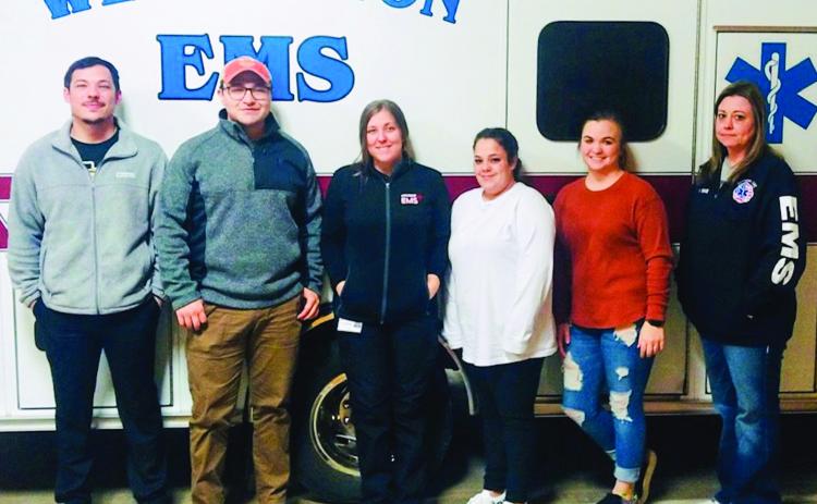 Current Wellington Emergency Medical Technician (EMT) students, including Jared Casas, of Memphis, left, Bryan Yates, of Pampa, Rebekah Hawley and Chelsey Garno, both of Childress, instructor Carle Kemp and Krystle Tarver, both of Wellington, take a break during a recent class at the Wellington Emergency Medical Service (EMS) barn. Courtesy Photo
