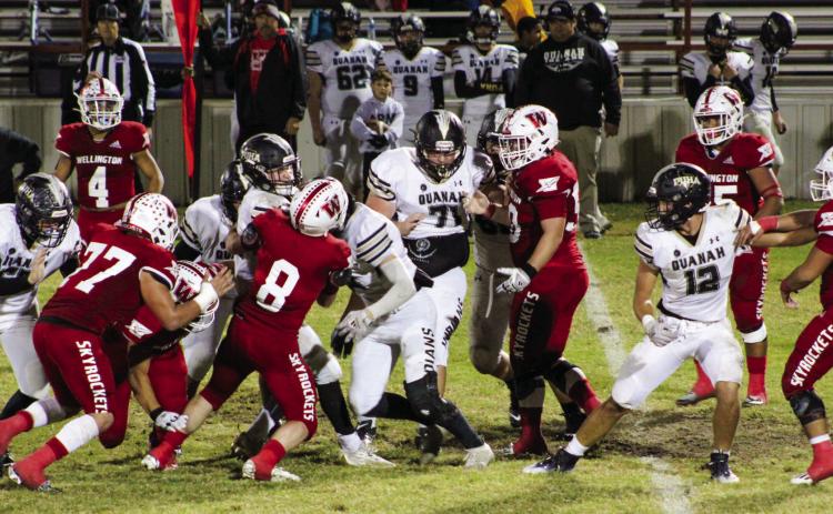 Skyrocket Caleb Strickland (8) rushes in for a tackle against the Quanah Indians last Friday, Oct. 28 with assistance from Gumaro Rincon (4), Rey Ramirez (77), Blake Strickland (50), Ethan Nevarez (44), Fabian Pina (65) and Ramon Rodriguez (51). Shauna Salinas/The Red River Sun