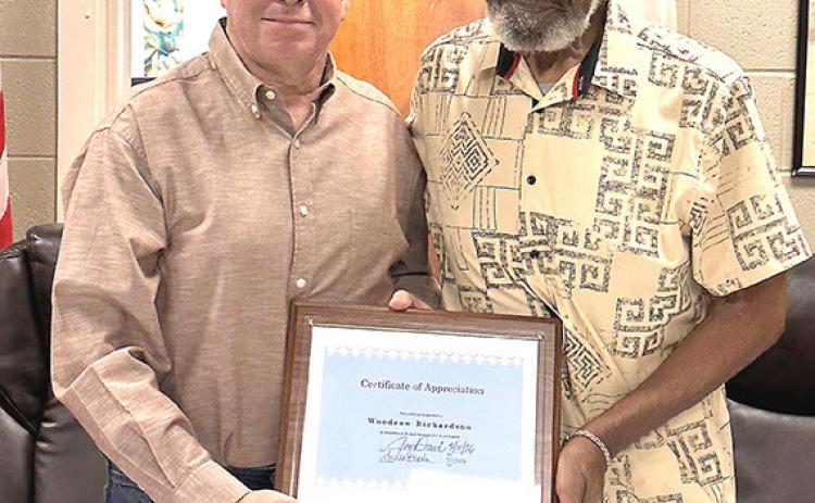 Mayor Joe Davis presents an appreciation award to Alderman Woodrow Richardson for his 24 years of service to the citizens of Memphis during Monday’s council meeting.