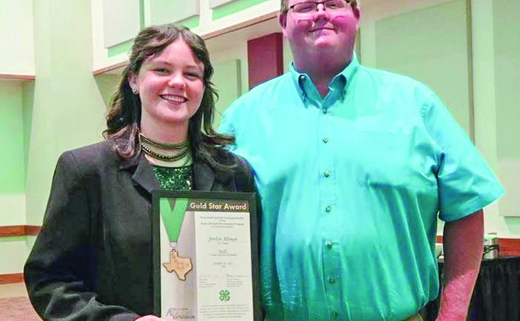 A senior at Memphis High School, Jordyn Altman accepts the Gold Star Award at the recent District 1 Gold Star Banquet in Canyon. She is congratulated by Hall County AgriLife Extension Agent J.D. Schnitker. The Gold Star Award is the highest achievement award given by the Texas 4-H Youth Development Program through the County 4-H Program. Courtesy Photos
