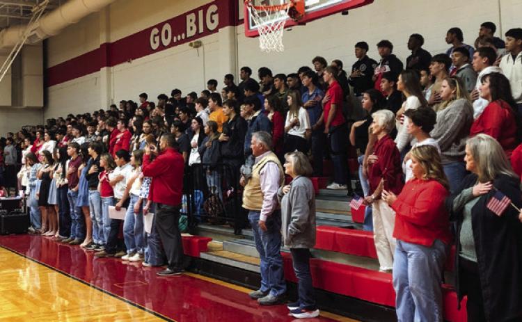 Veterans, guests, students, families and friends fill the seats of Wellington High School gymnasium for a solemn Veterans Day tribute at 9:30 a.m. Tuesday, Nov. 11. The Red River Sun/Bev Odom