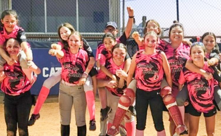 The Tornado Twisters finish an undefeated season (14-0), earning championship hardware at the Childress Little League Home Run Derby on Sunday, May 17. From left: Paisley Egerton, Kyleigh Garrison, Allison LaCario, Zoey Thrash, Coach Randy Arnn, Oaklynn Fuller, Teagan Britten, Virginia Meade, Raynee Arnn, Coach Vanessa Arnn, Robyn Torres, Paisley Jackson. COURTESY PHOTO
