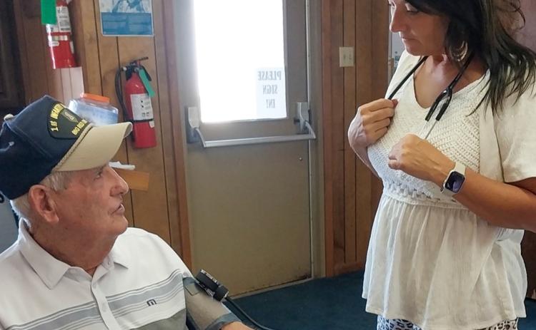Ken McLendon receives a blood pressure check from Angels Care Home Health Account Executive Melissa Conner prior to the Thursday, June 19 luncheon at the Childress Senior Citizens Center. Angels Care Home Health makes regular visits to the center to administer blood pressure checks to luncheon attendees, who often stay for a game or two of dominoes following the meal. Grace Holman