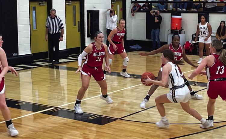 Lady Rockets Briley Waters (15), Audrey Jones (22), Kaitlin Bawcom (13), Asia Shrubs (21) and Presley Kane (2) stand defensive as a Lady Indian drives up court, hoping to put some points Friday night, Feb. 3. The Red River Sun/Shauna Salinas