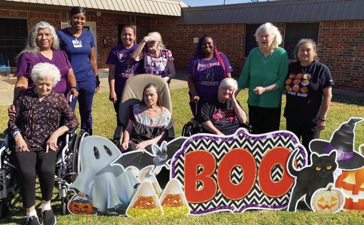 Wellington Care Center residents enjoy a cool, crisp, fall morning outing to relish in their “BOO” yard sign message from Ashley Long, longtime nurse for Wellington Independent School District. Not only did she send the card but chocolate candy, too. Hometown Yard Cards owner Carrie Skelton even left the message up for an extra day for the enjoyment of the residents and staff. Courtesy Photo