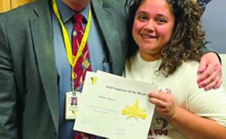 Memphis Independent School District (ISD) Superintendent William Alexander awards February Employee of the Month Andrea Carbajal, who teaches at Memphis Middle School. Photos Courtesy of Memphis ISD