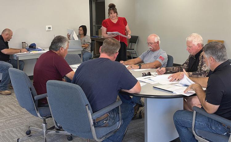 April Foard, Certified Public Accountant with Childress’ Foster &amp; Lambert, LLC, addresses the Wellington City Council, including City Manager Justin Mixon, Secretary Marci Peters, and Councilmen Jimmy Cantu, Jr., and Brent Martin, Eddie Langford, Kenneth Warren, and Brandon Ward, concerning the Fiscal Year 2025-2026 Audits during its Oct. 6 meeting. INTREPID PHOTO / BEV ODOM
