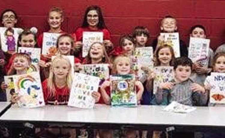 Collingsworth County 4-H Clover Kids and Sparklers display display pictures they colored for Kaydence Mixon. The daughter of Justin and Natasha Mixon, 17-month-old Kaydence is fighting Acute Myeloid Leukemia (AML). Courtesy Photo