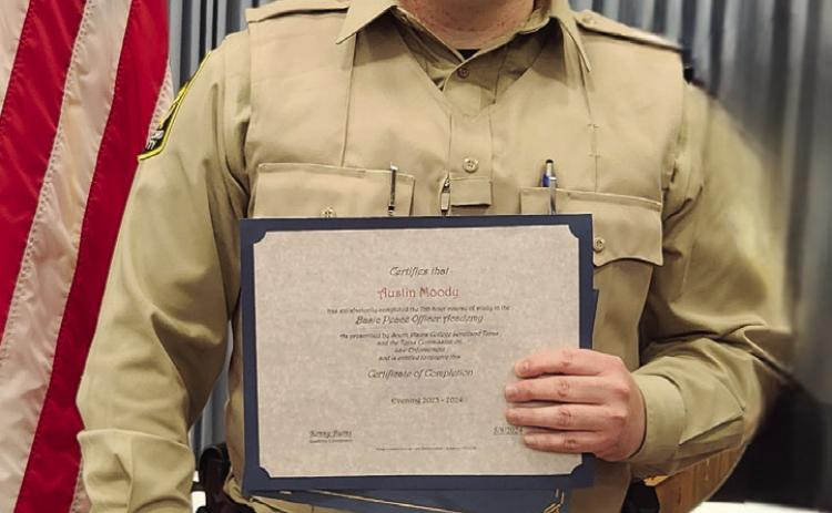 Austin Moody, a 2008 graduate of Wellington High School, accepts his Certificate of Completion for South Plains College Basic Police Officer Academy at a recent ceremony in Levelland. Moody serves in law enforcement in Hansford County. Courtesy Photo