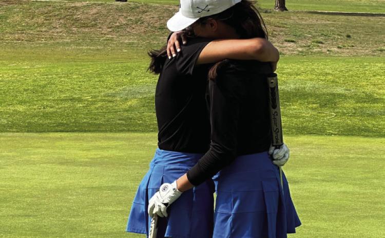 Childress’ Elena Jurado hugs her younger sister, Isabella Jurado, after defeating her in a playoff hole during the Region 1-3A Tournament to qualify for the final spot to the UIL Class 3A State Tournament. Courtesy Photo