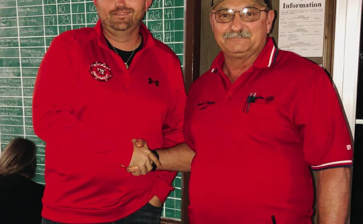 In the sole contest race in Collingsworth County, Pct. 1 Commissioner Farris Nation, right, retains his office by only six votes. Write-in candidate Justin Mixon congratulates Nation in the tight 193-187 final vote. The Red River Sun/Bev Odom