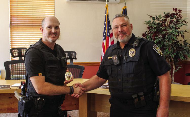 Childress Police Department Chief Bill Bridgwater welcomes Officer Glen Egerton, of Childress, aboard the department at a swearing-in ceremony Wednesday, Aug. 7 in the Childress City Hall Council Chambers. The Red River Sun/Elizabeth Tanner