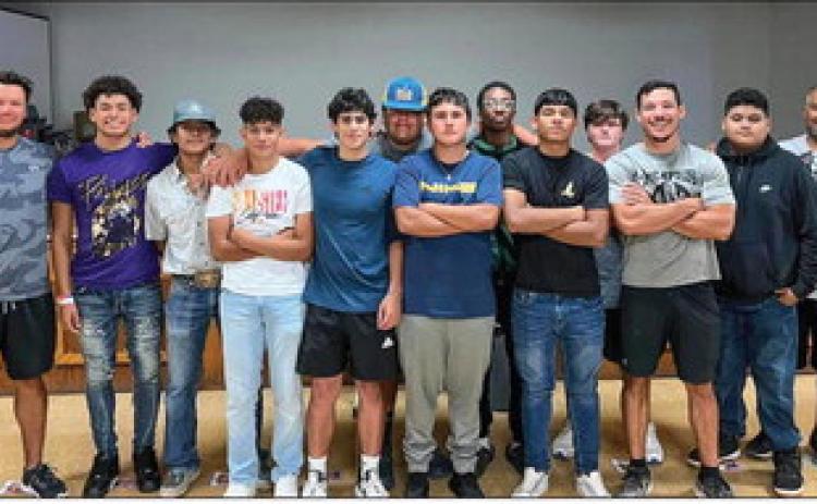 Memphis Cyclone football players, as well as coaches David Jurado, Jared Casas and Clayton Garcia, aid at Snack Pak 4 Kids Memphis’ recent Packing Party in which volunteers, including the Lady Cyclone volleyball team and coaches, Travis Elementary School, Austin Elementary School and Memphis Middle School students and staff and members of the First Baptist Church, packed Snack Paks for 100 local children. Photo Courtesy of Snack Pak 4 Kids Memphis