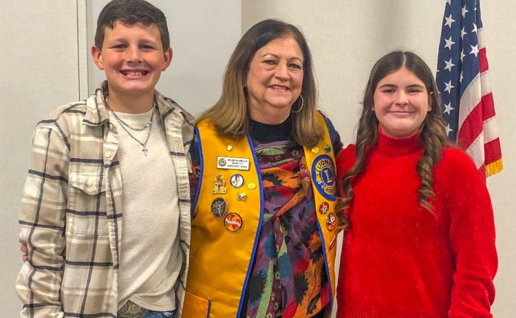 Wellington Lion Margret Wood welcomes program presenters Garrison Proffitt and Rachel Strickland to the Monday, Jan. 15 meeting of the Wellington Lions Club. The Red River Sun/Bev Odom