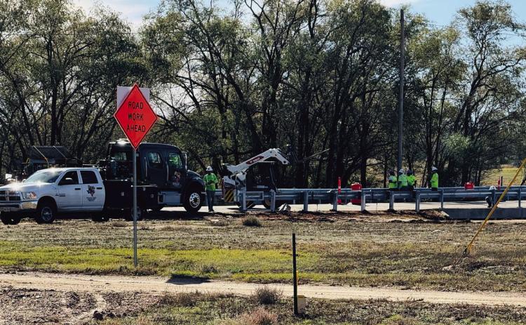 Texas Department of Transportation (TxDOT) contractors install guardrails on the FM 338 bridge in Dodson on Monday, Nov. 11. The extensive highway upgrade project began in October 2024 with replacement of the Atteberry Creek bridge. Photo by Jim Ellis
