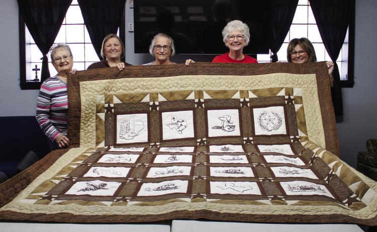 Joyful Quilters members, from left, Virginia Etheredge, Carrie Dobbs, JoAnn Meyer, Peggy Teague and Faith Self display their 2022 quilt, which will be raffled at the Childress Methodist Women Bazaar and Food Fest on Saturday, Nov. 19 at the Childress First United Methodist Church. Not pictured are Yvonne Ellis, Gina Inman and Mary Sanders. The Red River Sun/Elizabeth Tanner