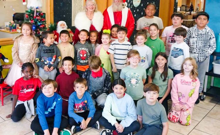 Santa and Mrs. Claus visit Wellington Opportunity Center