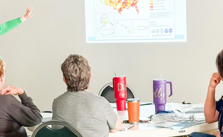 Jennifer Puryear, a meteorologist with RMBJ Geo, Inc., describes the 2026 drought monitor data to the attendees at the recent Rainwater Harvesting Workshop in Wellington. BEV ODOM/THE GREENBELT INTREPID