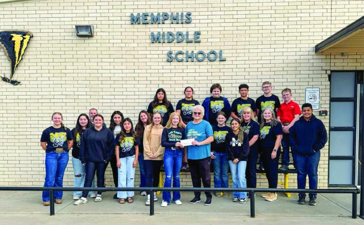 Memphis Middle School’s M5 Honor Society makes a $500 donation to Hall County Home Delivered Meals, represented by Kay Manuel. Memphis ISD