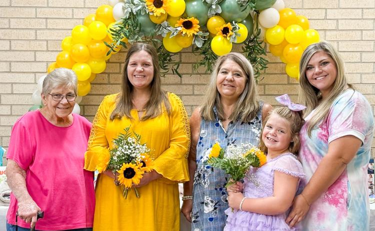 Grandmother Carole Meeks, left, guest of honor Jaci Roberson, mother Verna Wagner, niece Shayli Wagner and twin sister Joni Wagner gather amongst the gifts during the Saturday, Aug. 9 baby shower festivities. Courtesy Photo