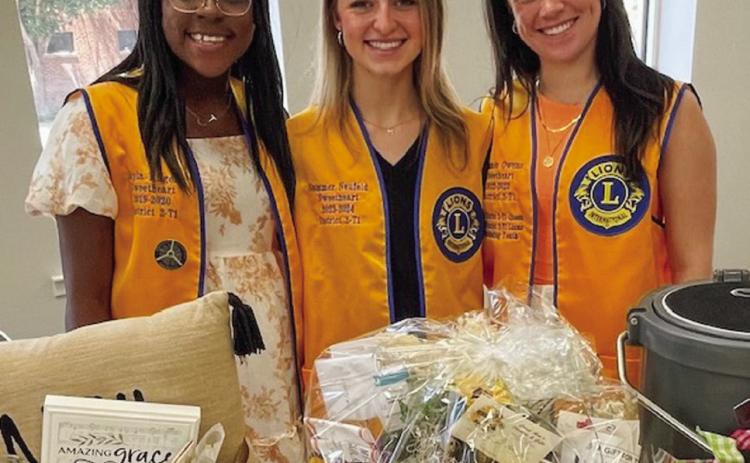 Wellington Lions Club Sweethearts Jayla Kilgore, left, Summer Neufeld and Summer Owens assist with the Sunday, May 19 theme basket drawing in support of the fundraiser for Kilgore’s ongoing treatment of Neuromyelitis Optica (NMO). Courtesy Photo