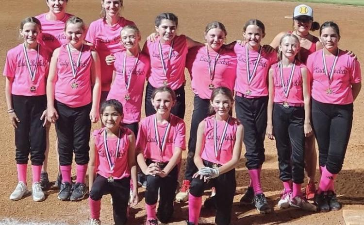 The first year for seven of the Lady Rockets to play softball, one mom described the girls as growing tremendously from game one to the last game and falling in love with the sport. Front row, from left: Juliet Solis, Raylie Sims, Peyton Roberson. Second row, from left: Blair Ward, Presley Kemp, Calleigh Henard, Quinn Roberson, Hadlee Patterson, Berkeley Ward, Cora Henard, Sara Morris. Back row, from left: Statistician Tana Roberson, Coach Molly Sims, Coach Lauren Patterson. Courtesy Photo