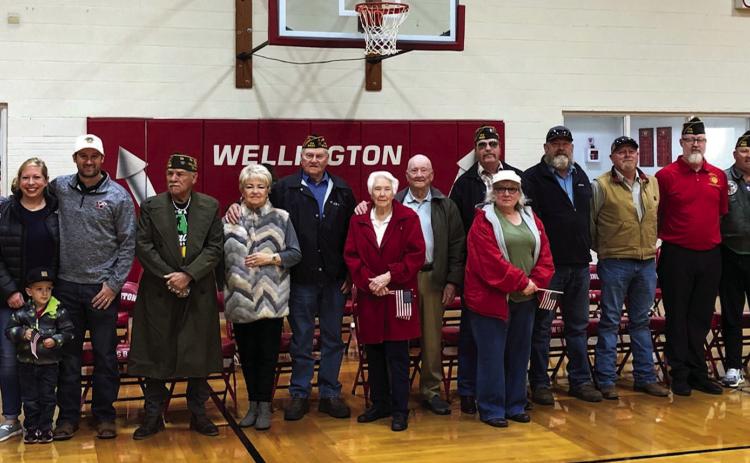 Wellington High School welcomes special guests to its annual Veterans Day tribute at 9:30 a.m. Friday, Nov. 11 in the gymnasium. From left, Barbara Roberson, Katherine Reeves, Abby, Bradley and Ethan Cole, Adam Sosa, Charlotte and Tony Stephens, Doris and Harry Stallings, Jeff and Alice Pastor, Heath Neeley, Lance Stephens, Lukas Wilbur, Mike Chandler, Jack and Shauna Gillentine. Not pictured: Denise Stephens, Lucy Owens. The Red River Sun/Bev Odom