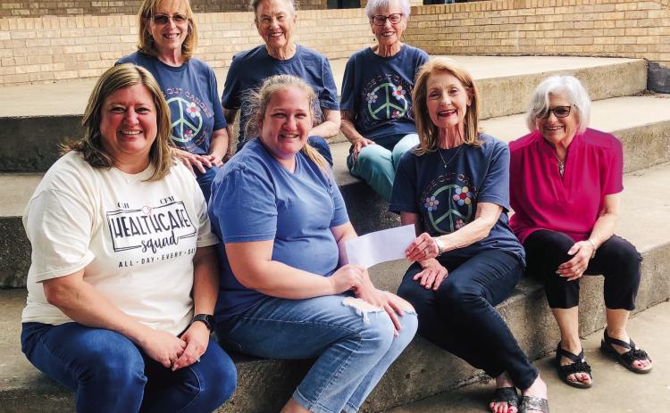 WPWC presents ‘Peace Out Cancer’ proceeds to HUGS