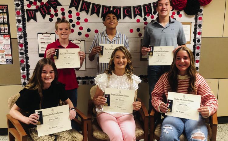 Daughters of the American Revolution present Wellington Junior High School Youth Citizenship Awards to open the Wellington Junior High School 2025 Awards Assembly at 10 a.m. Monday, May 12. From left: sixth-graders Tatum Martin and Radley Keys; seventh-graders Ava Inman and Angel Segovia; and eighth-graders Gannon Guy and Cix Killian.