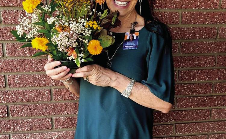 Memphis High School floral design students recently surprise Region 16 Education Service Center Coordinator of Accountability, Assessment and School Improvement Christine Scroggs with a bouquet of flowers. “[The] Memphis Independent School District floral design students are amazing,” Scroggs said. “[They do] incredible work that brings such joy.” Photo Courtesy of Memphis ISD