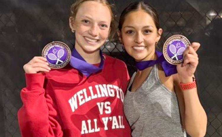 Taytum Kane, left, and Ingrid Granadoz finish as the third-place bronze medalists in girls’ doubles on Monday, March 23 in Spearman. Amy Inman serves as Wellington’s tennis coach. Wellington High School