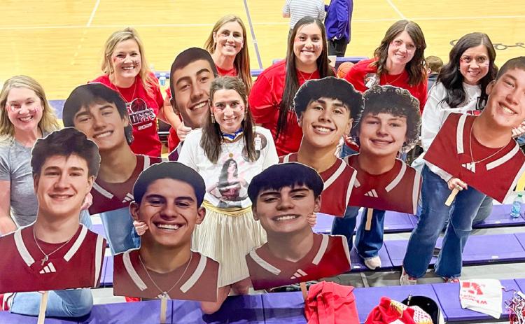 With a “superhero” theme, Skyrocket moms display cutouts of basketball players prior to the UIL 2A Division 1 Regional Final Championship Friday evening, March 6 at Canyon High School. From left: Amanda Kane, Amy Inman, Christy Kane, Ashly Cantu, Denise Garcia, Megan Wischkaemper, Sandy Killian. Courtesy Photo