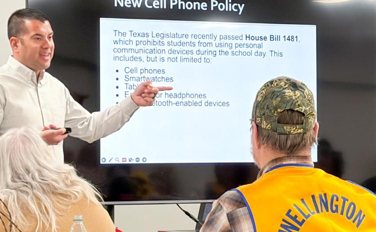 Wellington High School Principal Jermaine Cantu addresses the Wellington Lions Club at the Monday evening, March 16 meeting. Cantu emphasized that the new cell phone policy, imposed by the Texas Legislature, has initiated face-to-face social interactions that were previously paused by cell phone use. “Overall, it’s a really good policy,” Cantu said. The Red River Sun/Bev Odom