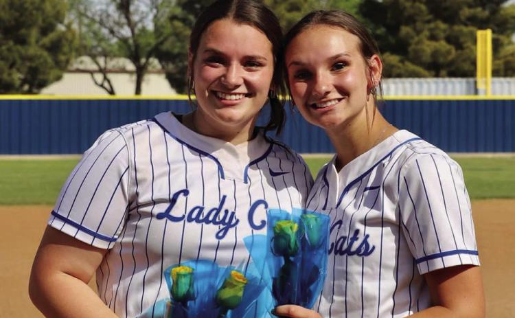 Childress Lady Cats Kaidie Hackler, a three-year varsity catcher and first baseman, and Jena Preston, a four-year varsity pitcher, are celebrated during senior night Friday, April 21. Playing the Abernathy Lady Lopes, the Lady Cats picked up an end-of-season 16-6 win. Courtesy Photo
