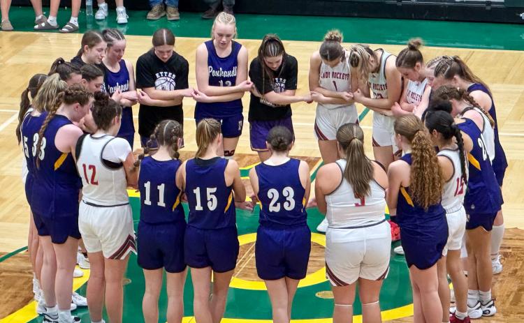 The Wellington Lady Rockets and Panhandle Lady Ettes bow their heads in prayer as Wellington ends its playoff run in the 2026 season, falling short a mere four points. The Red River Sun/Shauna Salinas