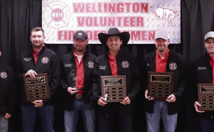 Members of the Wellington Volunteer Fire Department accept special awards at the recent banquet. Henry Wiebe, left, 20-Year Award; Colby Henard, “Kicking Ass” Award; Korn Wiebe, 20-Year Award; Kollin Kemp, Fireman of the Year; Dennis Peters, “Workhorse” Award; and Matt Wynn, “Brotherhood” Award. Molly Sims Photography