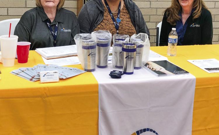 Panhandle Community Services (PCS) staff, including Utility Specialist Marcia Campbell, Communications Specialist Bianca Ramos and Pampa PCS Center’s Vicki Ray, set up an application workshop in Wellington Tuesday, April 18. The Red River Sun/Bev Odom