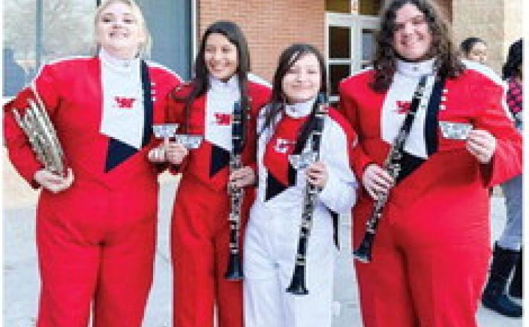 Cortlyn McKinley, left, Arianna Pena, Angela Molina and Rileigh Henard perform with the All-Region band on Saturday, Jan. 14 in Amarillo. Members of the Rocket Regiment, McKinley is a junior, while Pena, Molina and Henard are all seniors. Rocket Regiment Director Justin Mixon accompanied the musicians to the event. Courtesy Photo