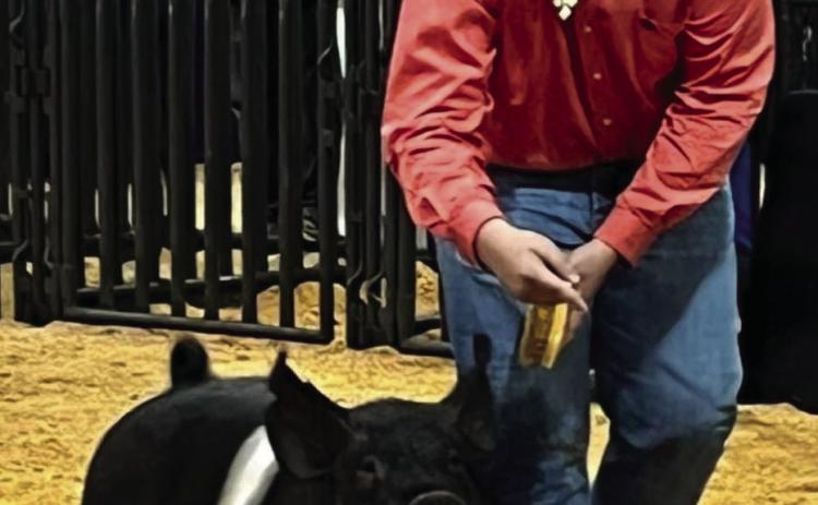 Wellington’s Hunter Stark shows his Duroc swine project at the 2022 Tri-State Fair last Sunday, Sept. 18, where he earned Reserve Breed Champion. “I’m proud of his hard work and willingness to do more every day,” Collingsworth County AgriLife Extension Agent Kenny Patterson said. “I look froward to watching him in the show ring his senior year.”