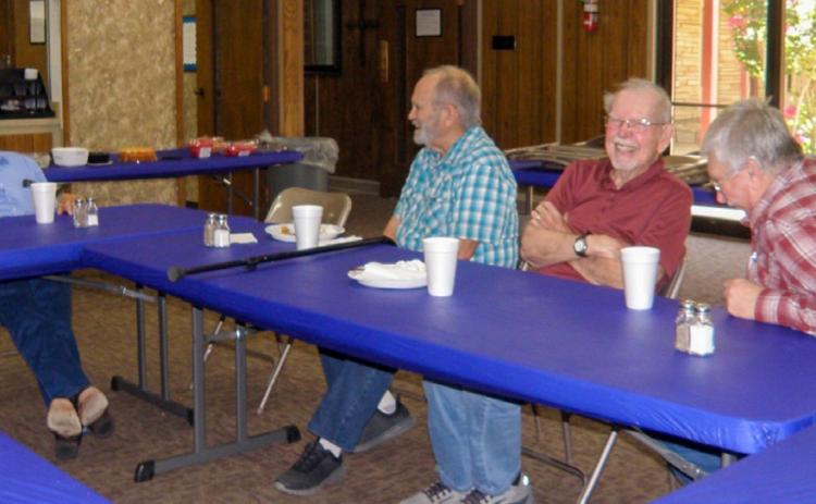 Joe Robinson, left, recounts his United States Navy days at the recent Adult Fellowship Luncheon at Childress Methodist Church. Robison’s talk, animated with hand gestures and facial expressions, with bits of audible laughter and abundant smiles, evoked laughter from listeners, as shown by, from left, Harvey Dobbs, Joe Steele and Kevin Crain. Also in attendance were Childress Methodist Church Pastor Lou Ellerbrook, Anne Fromm, Grace Holman, Lila Hoobler and Ann Simmers. GRACE HOLMAN