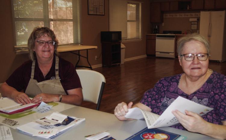Texas A&M AgriLife Extension Service of Childress County Family and Community Health Agent Sandra Moody, left, presents the second session of the four-part series A Fresh Start to a Heathier You! Thursday, Nov. 21 at the Childress Housing Authority—Shady Grove Apartments Meeting Room. Among attendees was Phyllis Preston, right. Photo by Grace Holman