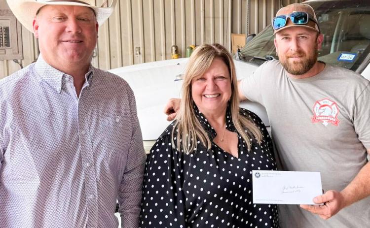 The 100 Club of the Texas Panhandle Executive Director Suzanne Talley delivers a $10,000 check to Samnorwood Volunteer Fire Department (SVFD). From left: SVFD Fire Chief Larry Wright, Talley, SVFD First Assistant Fire Chief Matt Tarver. COURTESY PHOTOS