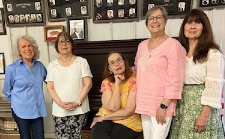 Friends gather amongst the class photos at Dodson’s 68th Annual Ex-Students Reunion Saturday, May 24 at Dodson Town Hall. From left, Carol Stribling-Chatham, of Pampa; Sheila Ford Lewis, of Hollis, Okla.; Cindy Hightower, of Plainview; Nancy Gulley Crawford, of Tyler; and Glenda Hightower Sena, of Dodson.