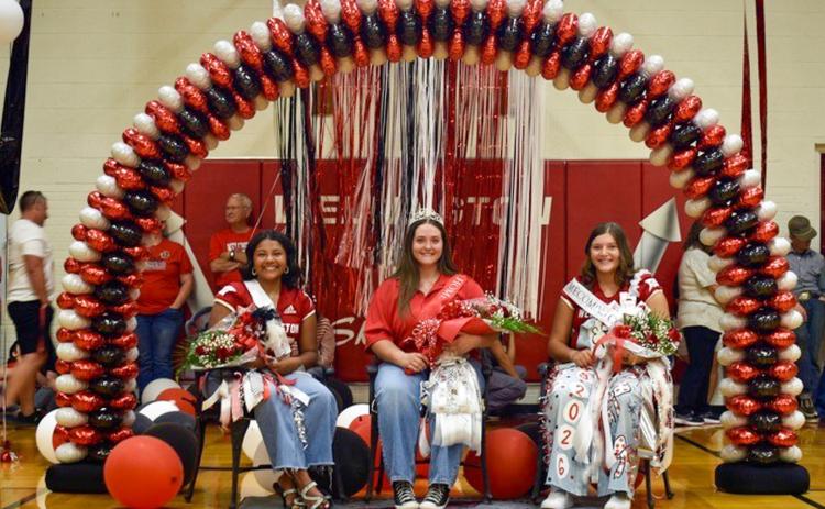 Rocket Regiment senior Bailey Steagall, center, accepts the honor of Band Queen during the Sept. 13 homecoming pep rally festivities in the Wellington High School gymnasium. First runner-up Jasmin Moreno, left; and second runner-up Eryn Torrez, right, complete the Rocket Regiment Homecoming Court. Junior Rocket Regiment boys served as escorts for the royalty. Back row, from left: Jacob Lee, Sawyer Smith, Christopher Reyes, Alladin Rodriguez, Kris Valdez. Wellington High School